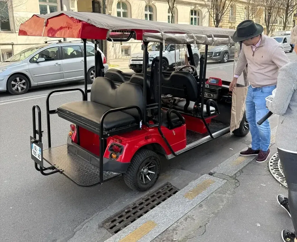 Six-seater golf cart picking up guests in Paris