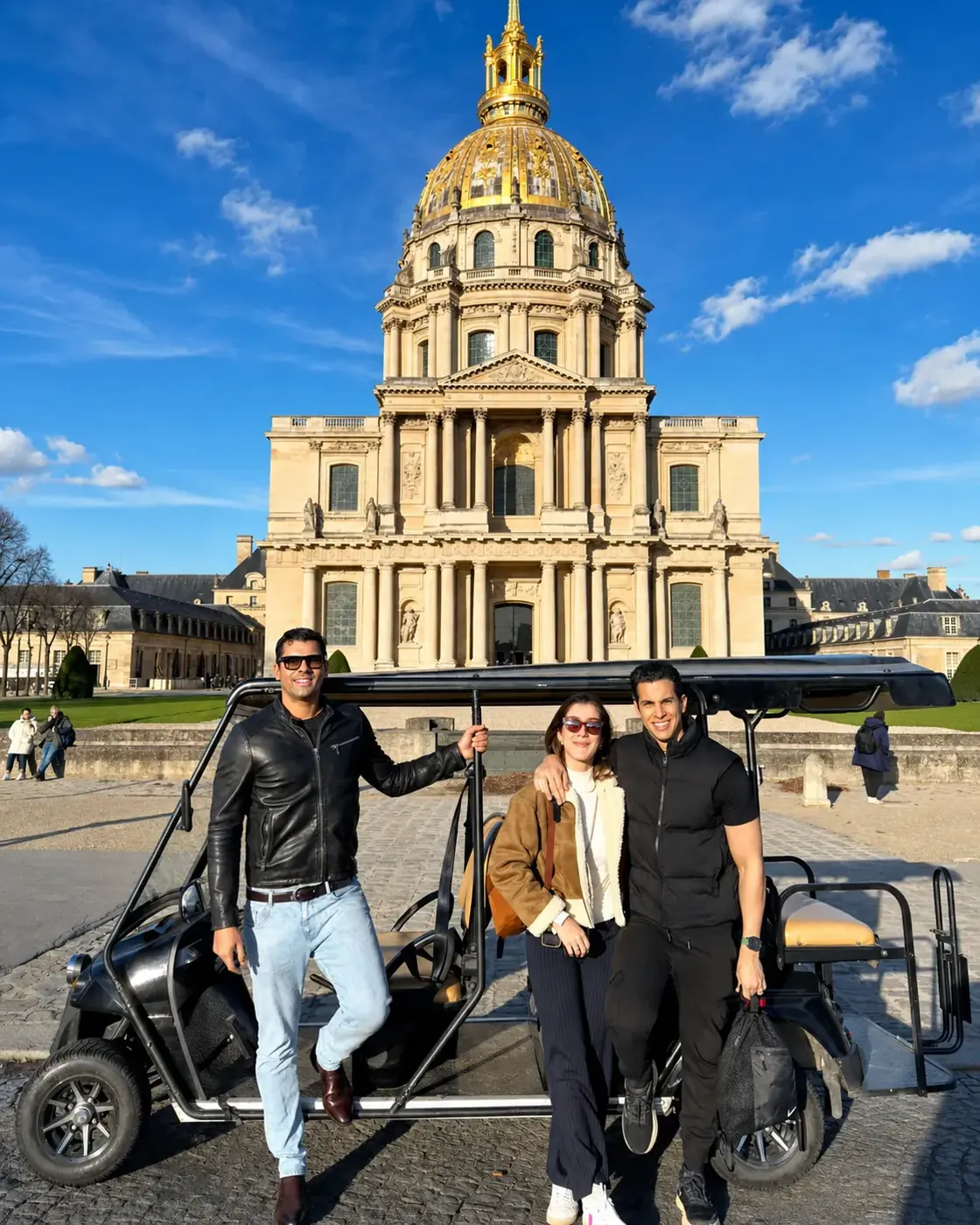 Guests posing with their golf cart at Les Invalides